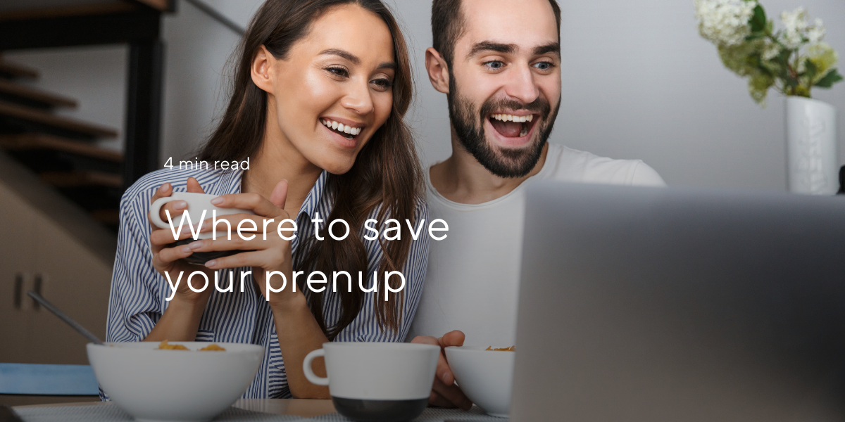 where to save your prenup couple drinking tea and looking on laptop