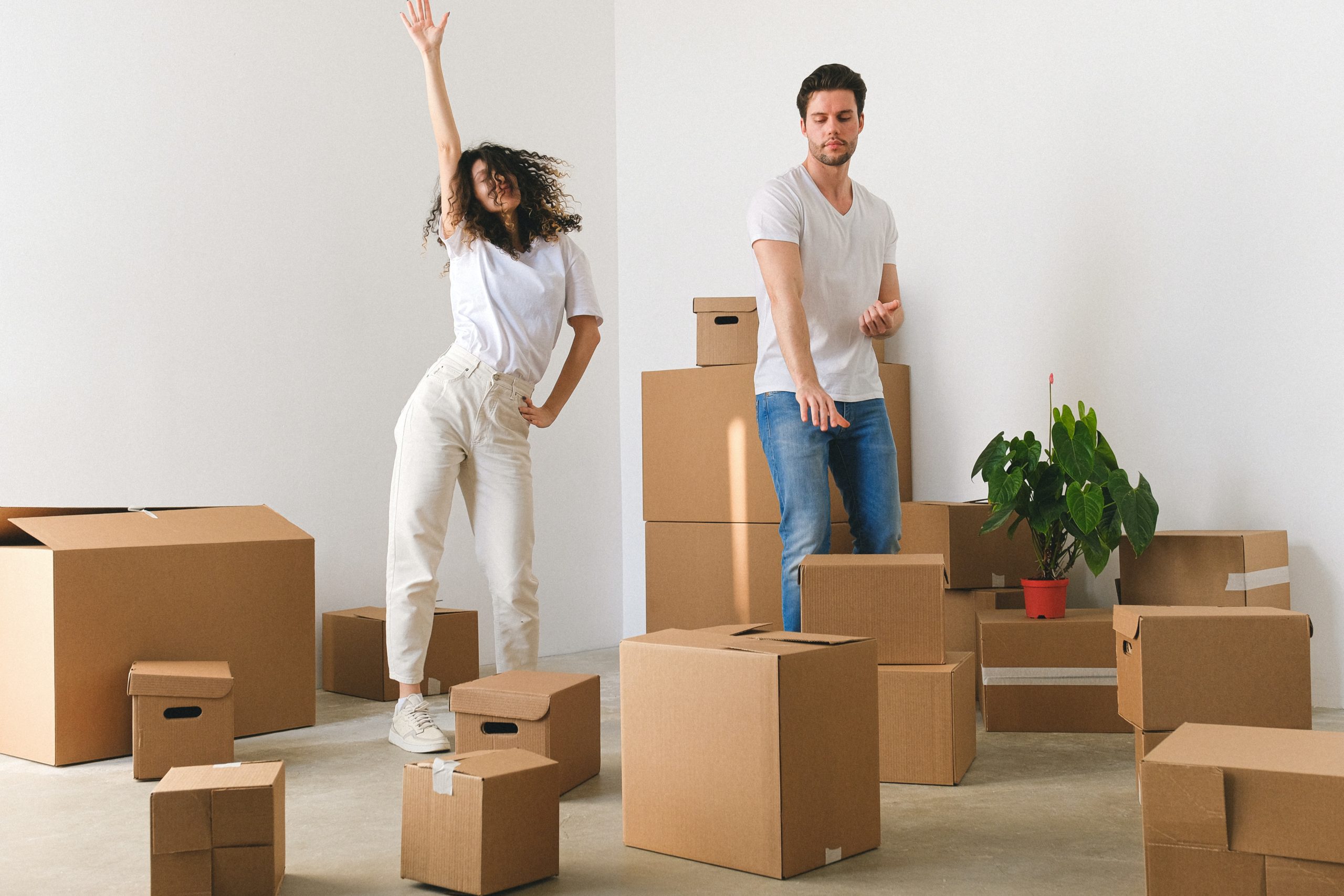 couple moving into new house with boxes everywhere