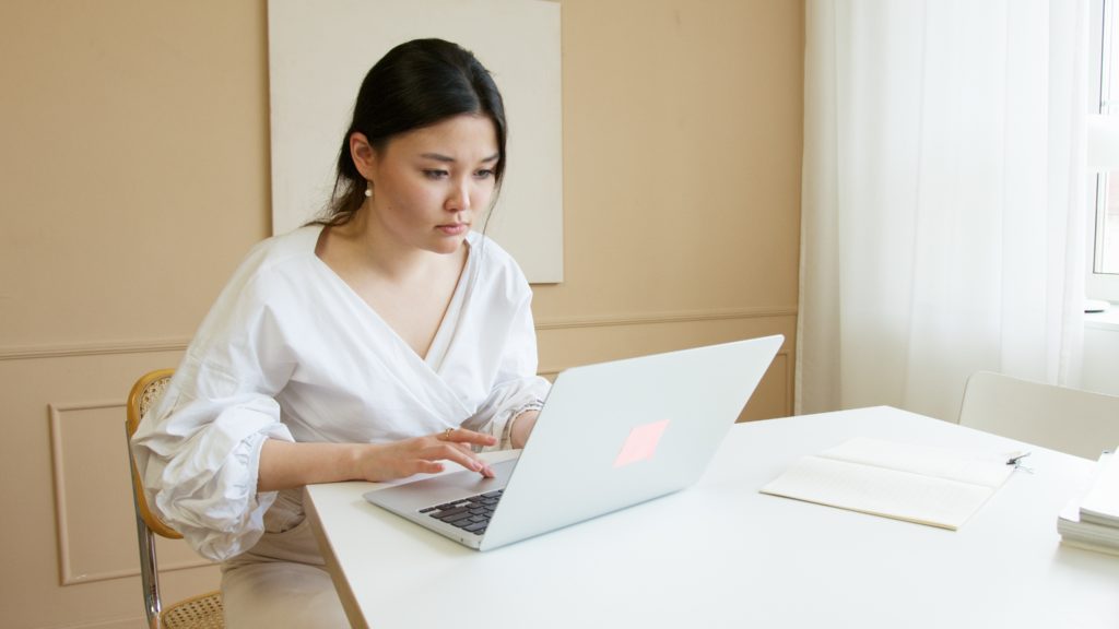woman looking at a laptop