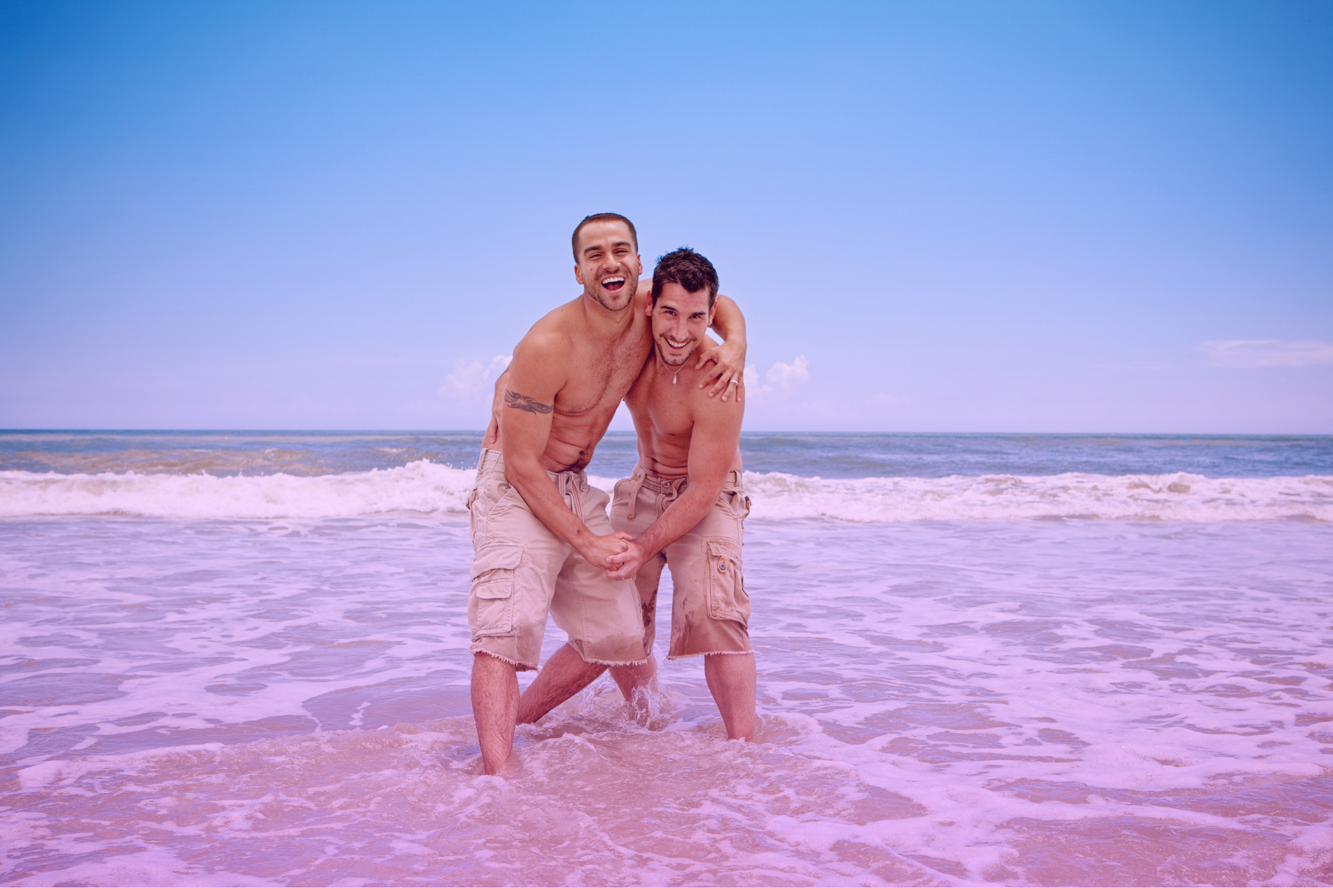Same-sex couple enjoying the ocean together