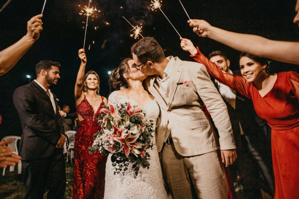 couple kissing under sparklers a personal style in their wedding