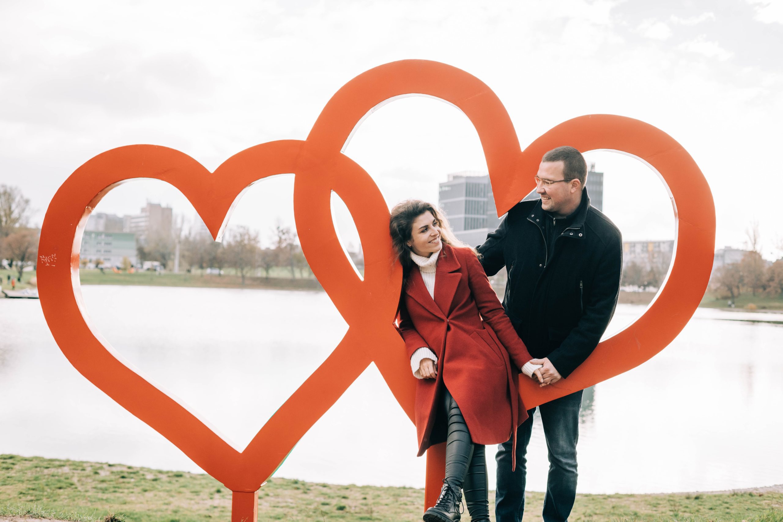 couple posing with two hearts thinking about How Long Do Prenups Last?