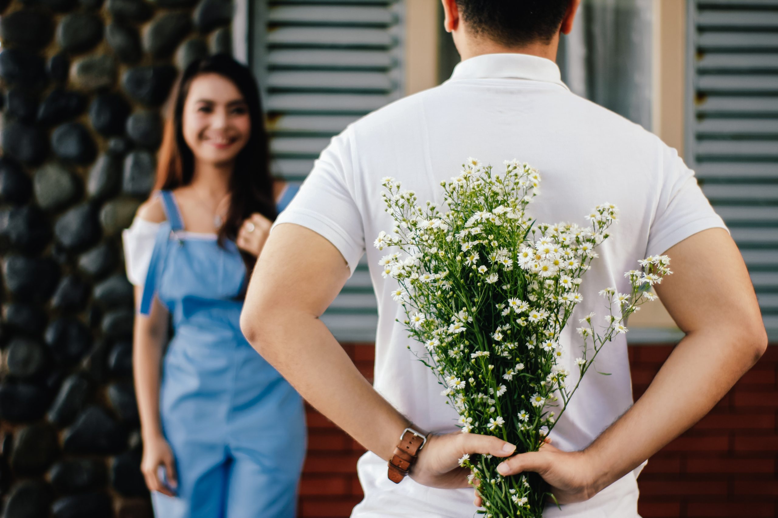 man has bouquet of flowers for his partner they are ready for Address Estate Planning In A Prenup