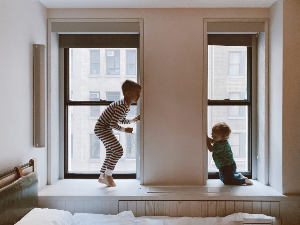 two kids playing in the window they receive alimony
