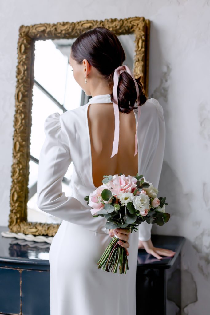 wedding hair in a ponytail with a ribbon