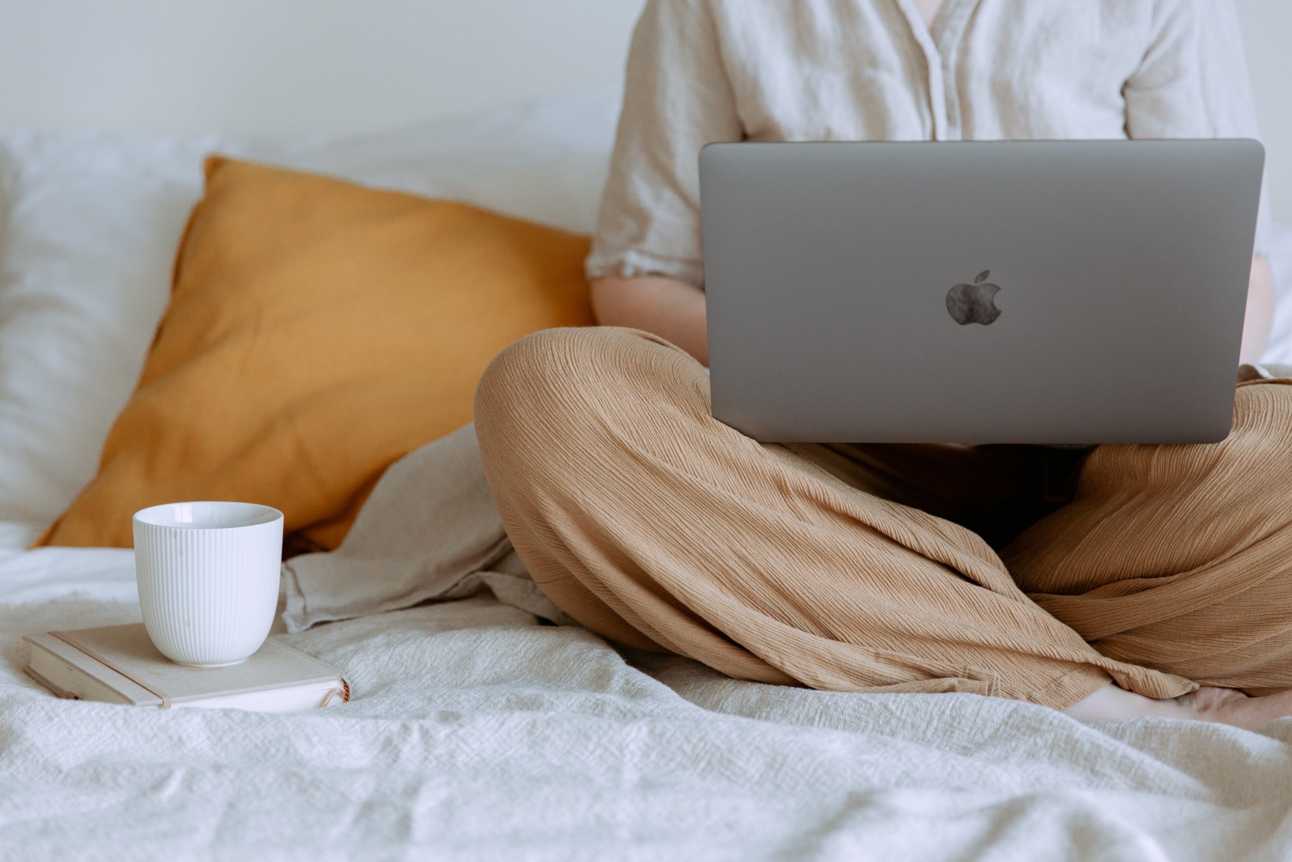 woman in bed with computer and coffee she Shouldn’t Use A Free Online Prenup Form