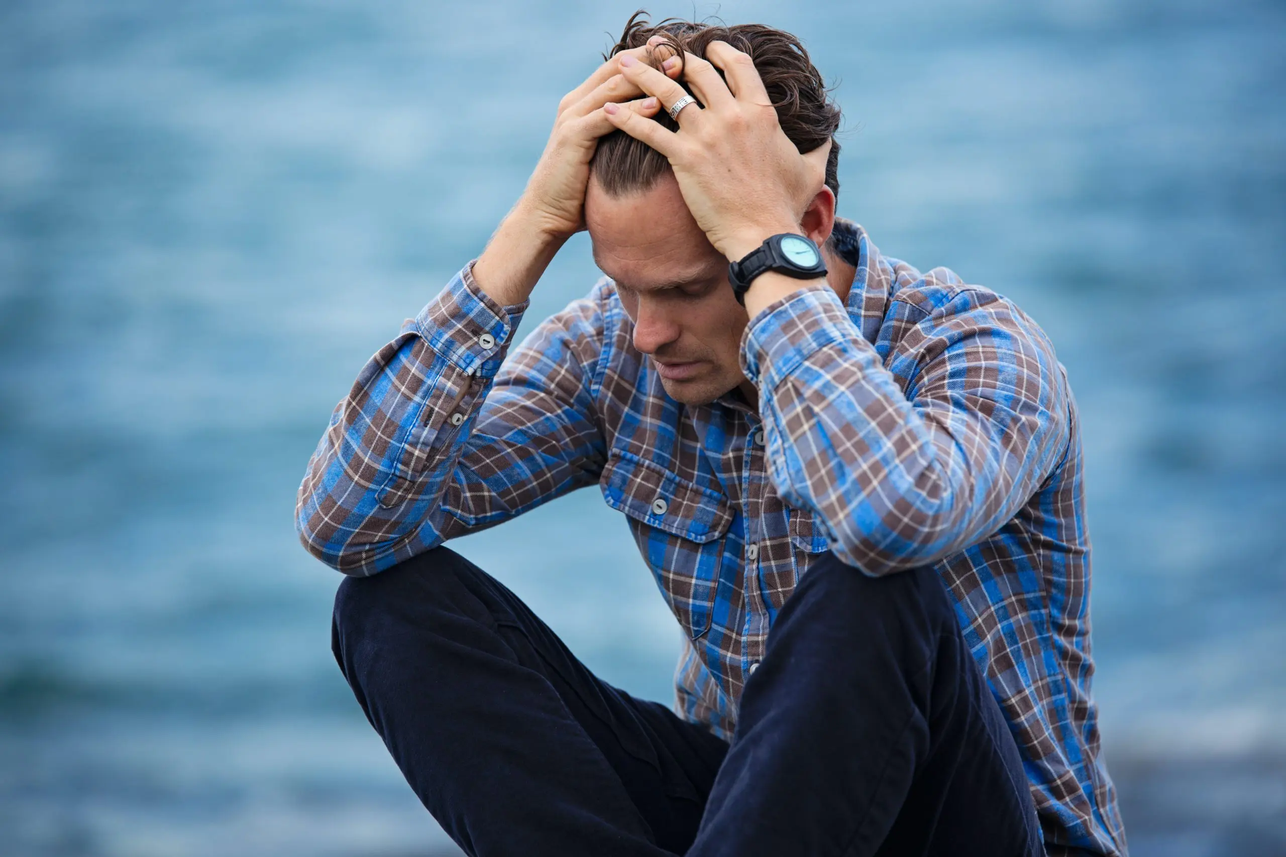 Anxious man in front the water Different Types Of Marriage Anxiety