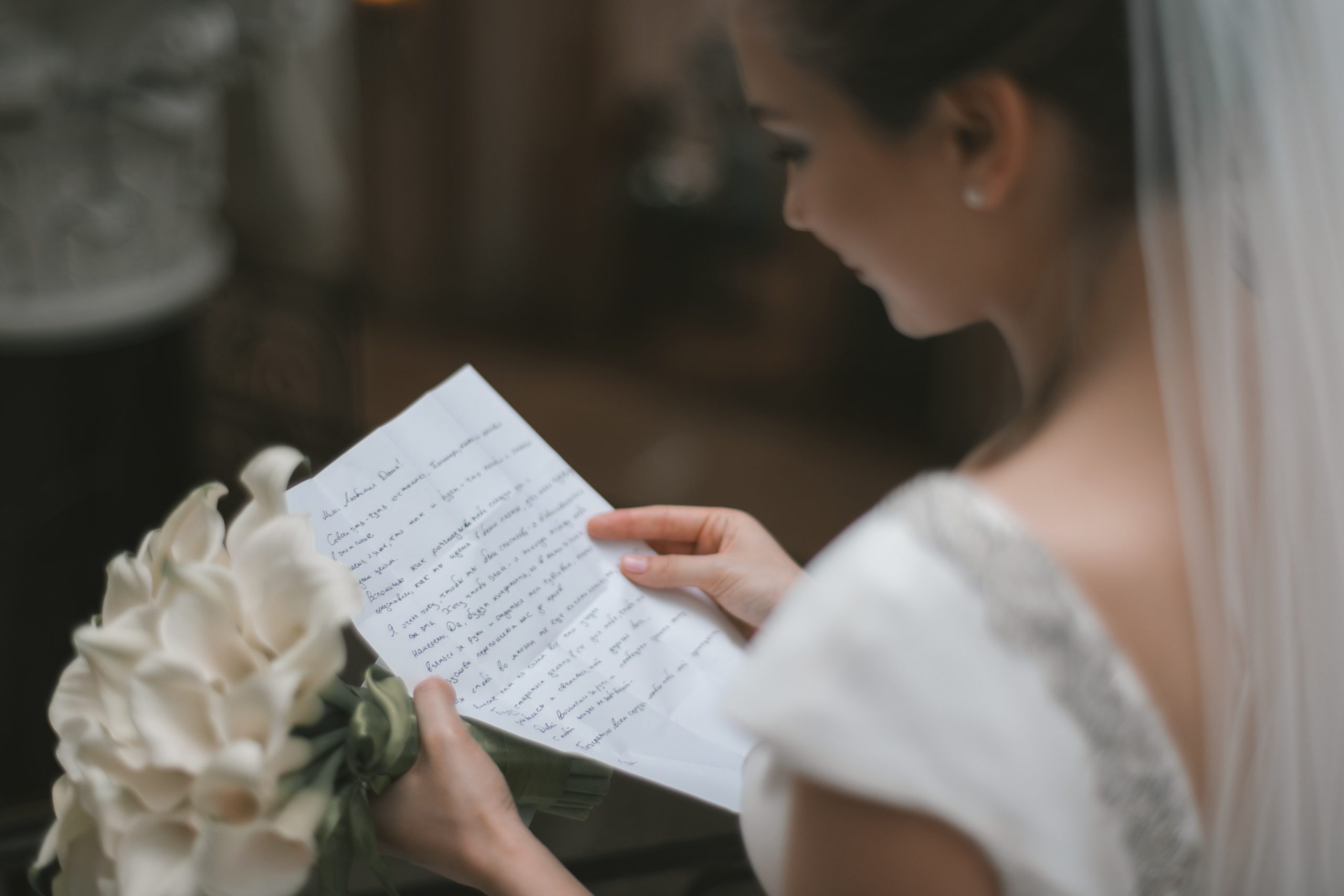bride reading her wedding vows, How Do We Write Our Wedding Vows?