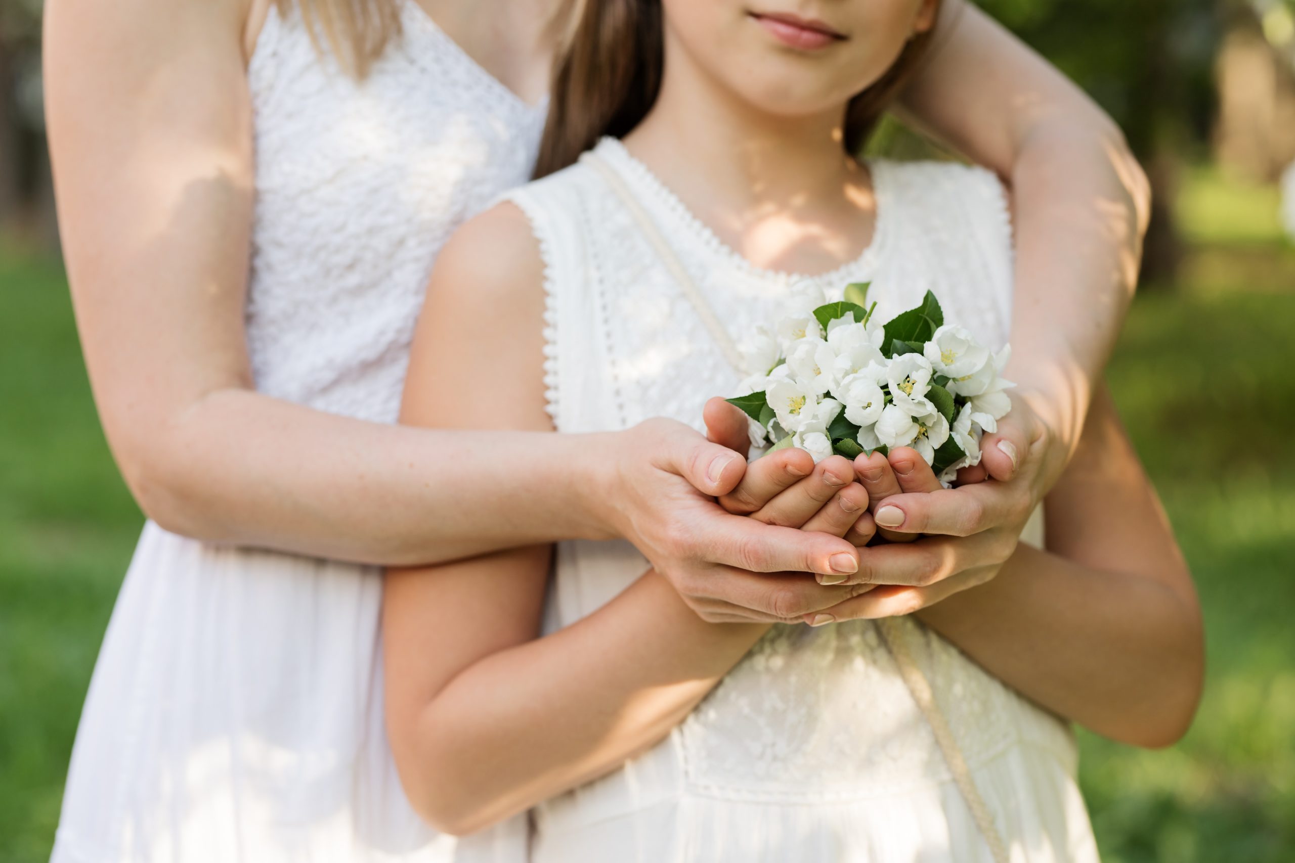 bride with niece holding flowers How To Include Your Nieces And Nephews In Your Wedding