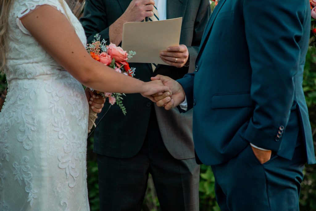 couple reading their wedding vows, How Do We Write Our Wedding Vows?