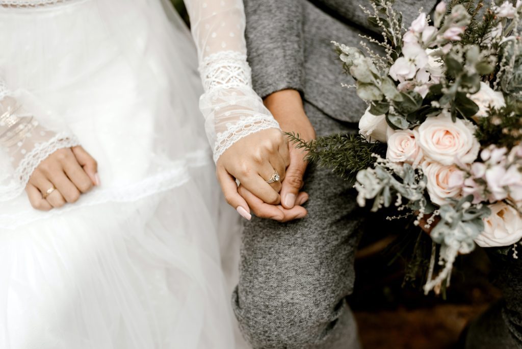 spouses holding hands Managing Post-Wedding Anxiety: Tips And Strategies 