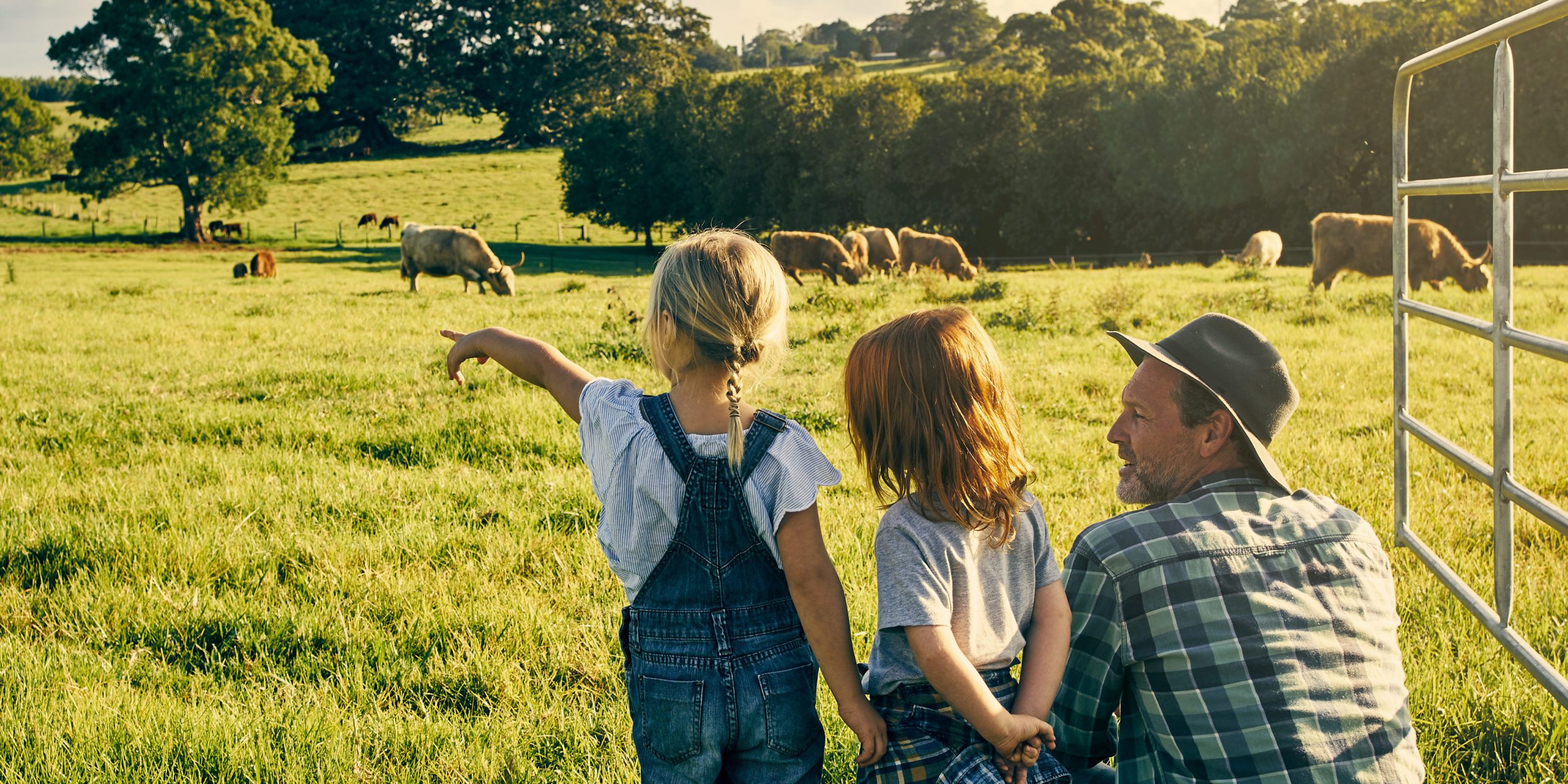 Creating A Prenup To Protect Farm Property dad-with-his-daughters-in-the-farm