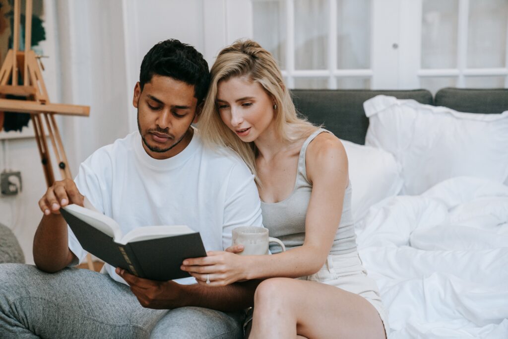Couple reading a book about How Do You Enforce A Prenup?