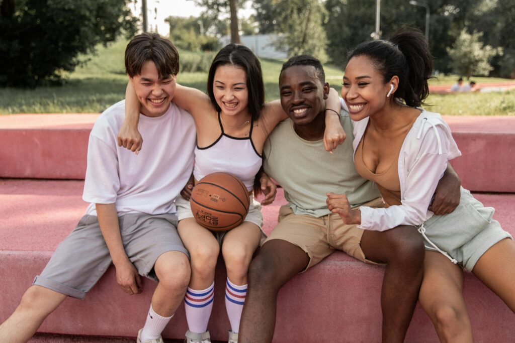 Two couples playing basketball
