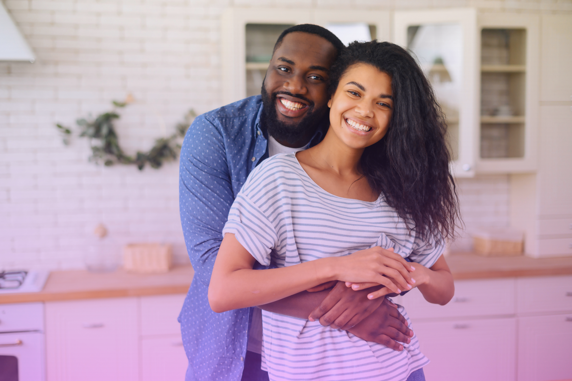 A couple embracing and smiling
