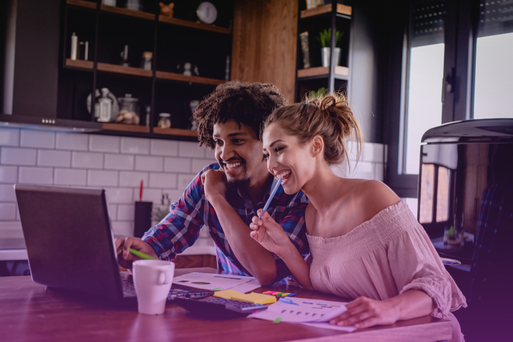 Happy couple celebrating their debt payoff milestone