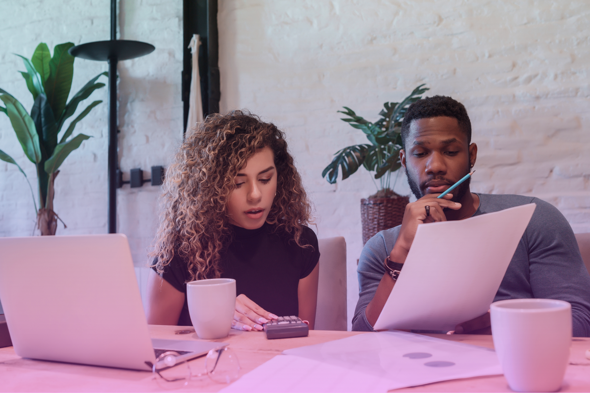 A couple meeting with a financial advisor to discuss financial planning strategies