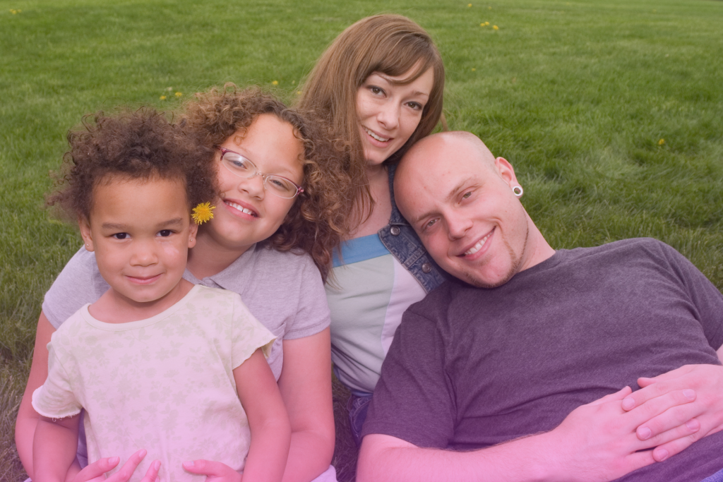 Blended family enjoying a day at the park together.