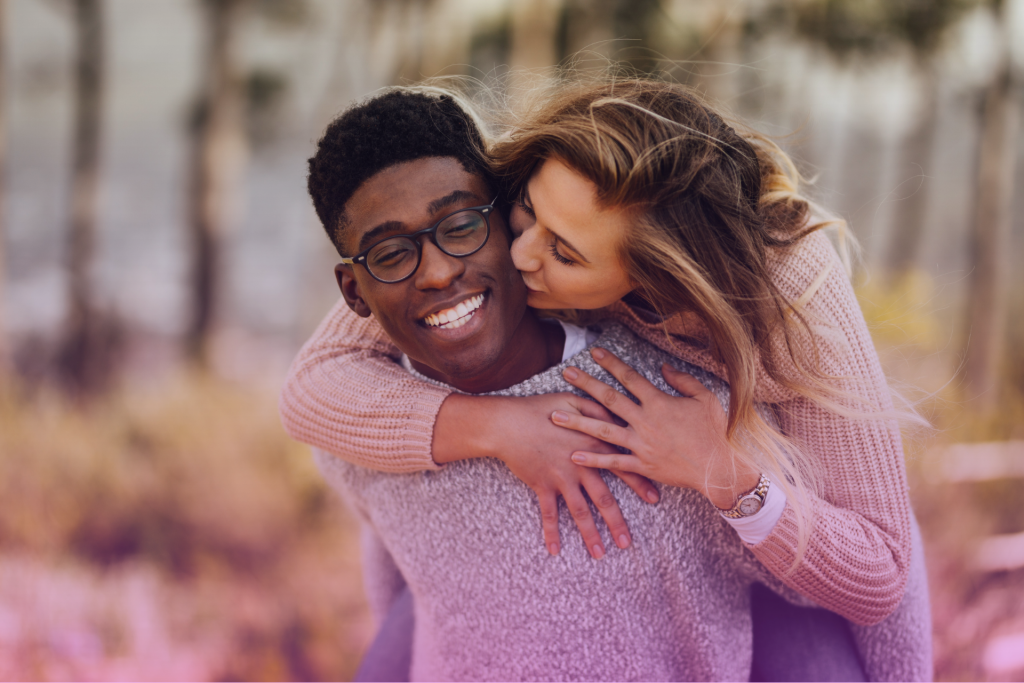 An interracial couple embracing, highlighting the act's protection for marriages between people of different races.