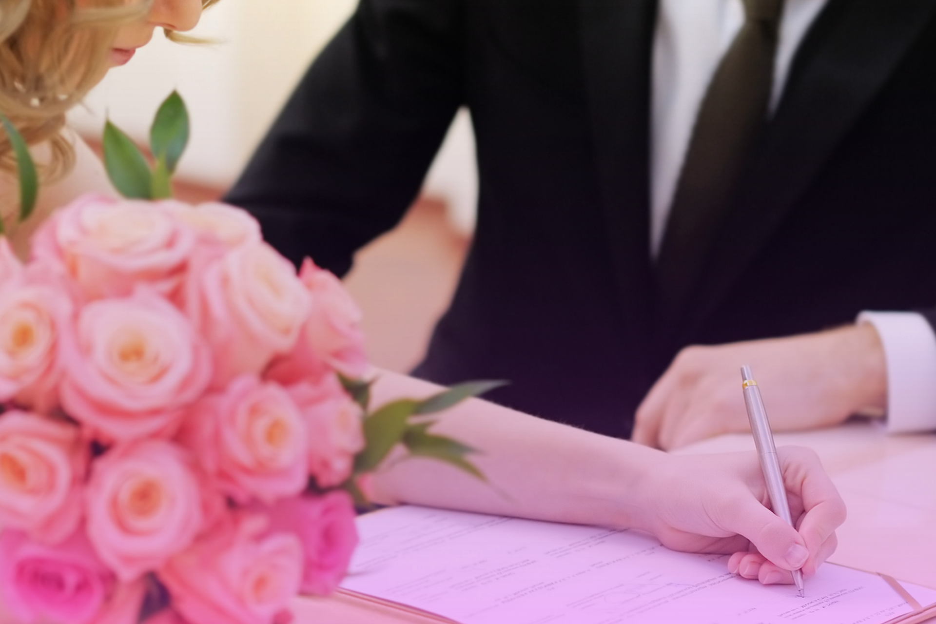 A couple holding a California marriage license, symbolizing the record search.