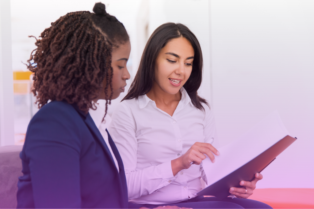 A couple sitting at a table with a lawyer, discussing legal documents related to embryo ownership.