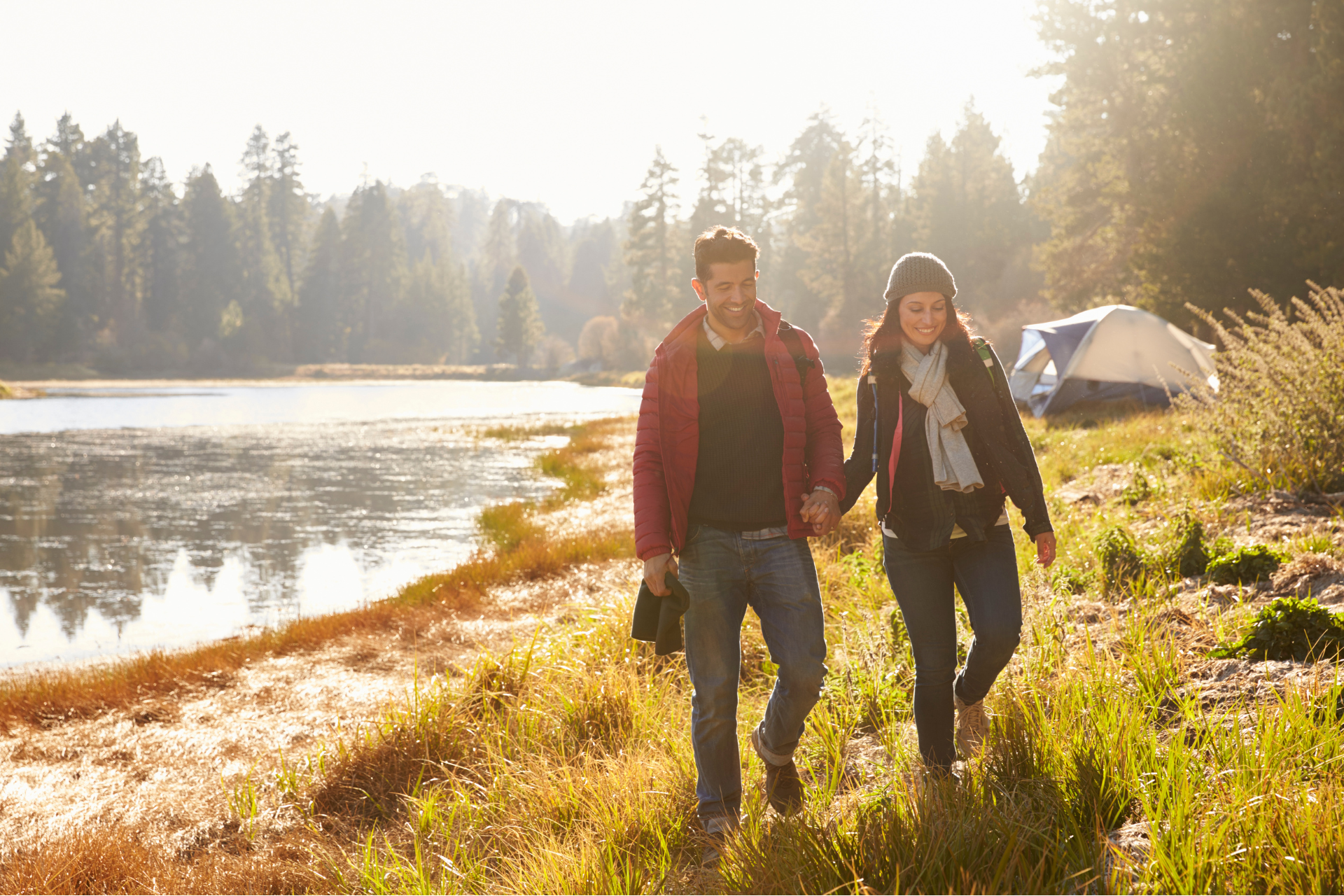 Couple camping in Wyoming walking hand in hand