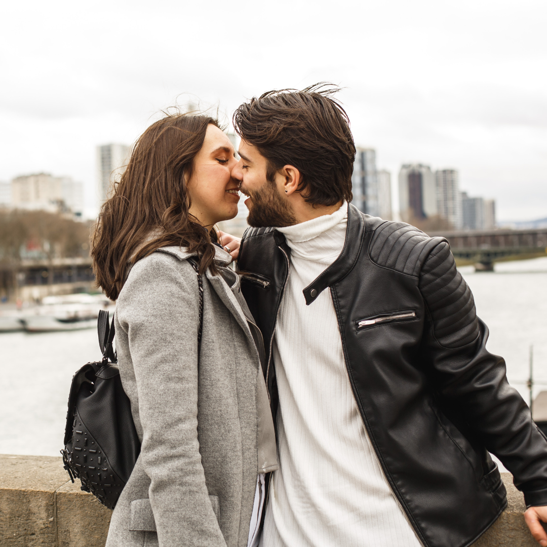 couple lovingly kissing on a cloudy day in Iowa
