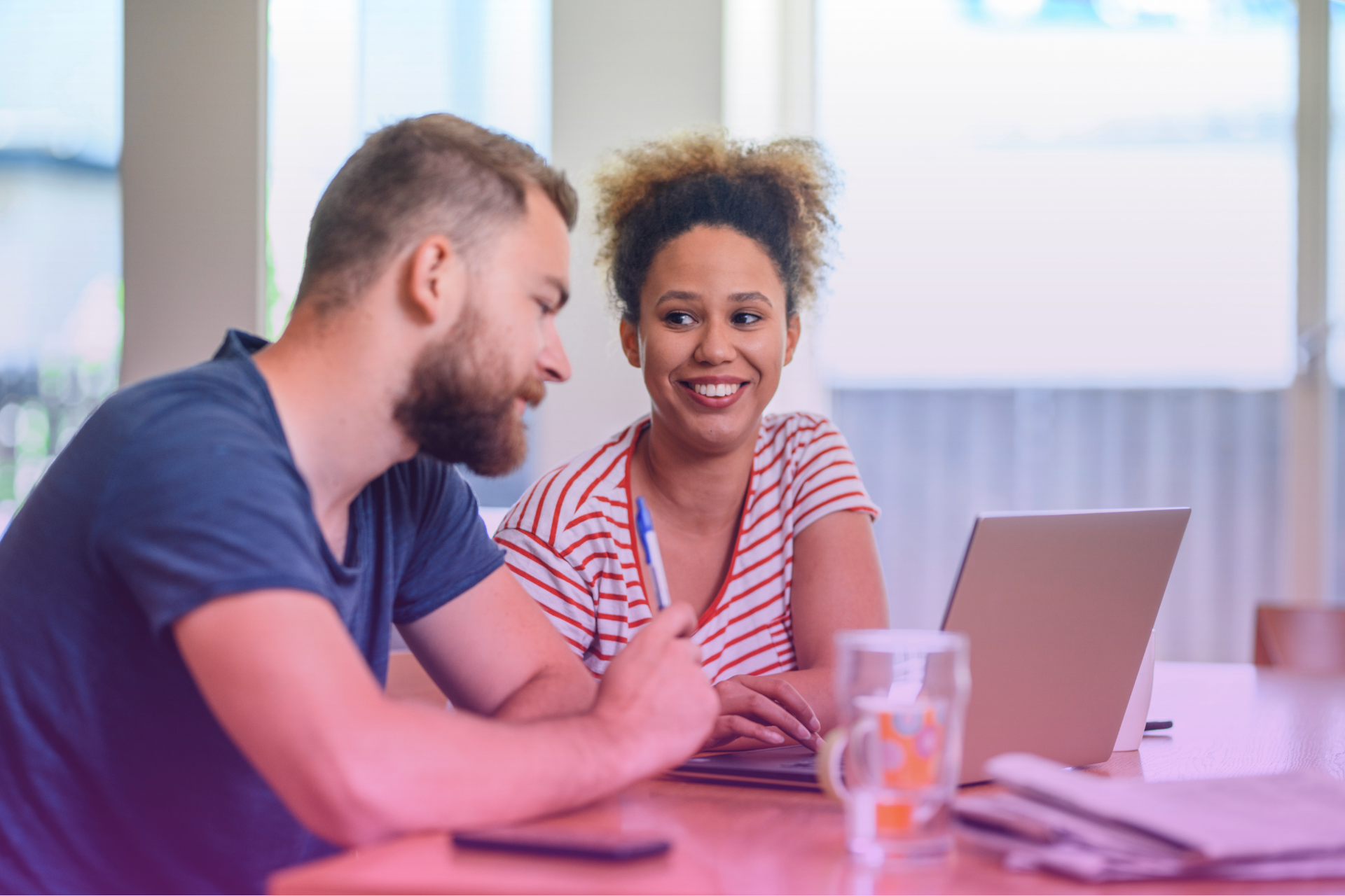Happy couple celebrating achieving their financial goals