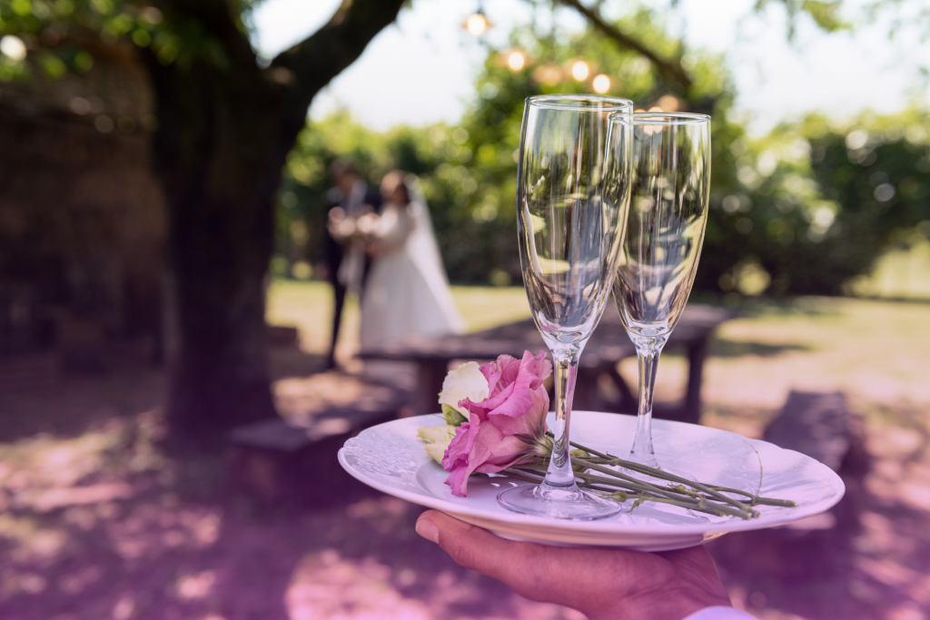 A team of catering staff efficiently serving drinks to wedding guests, contributing to a joyous and memorable celebration.