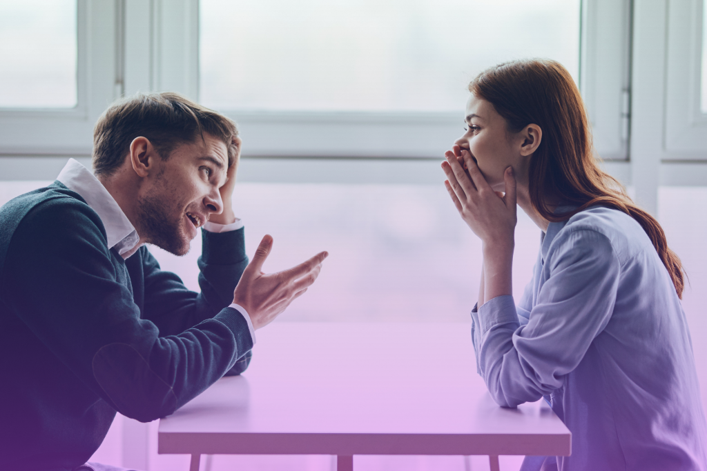 couple smiling and talking confidently encouraging open communication about finances.