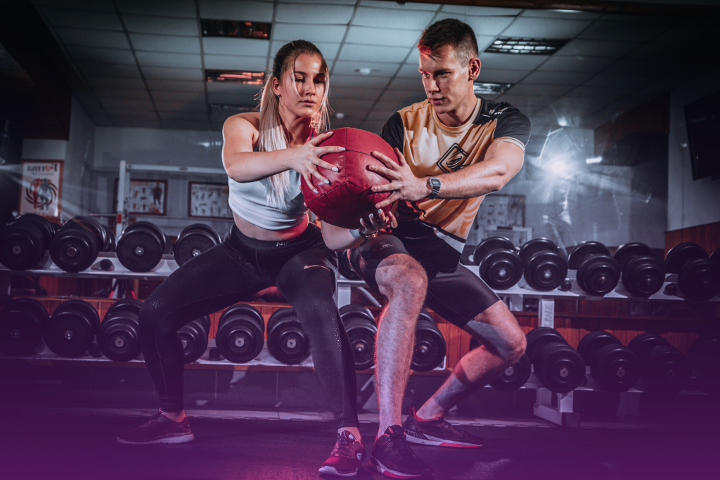 A photo of a couple working out at the gym, side-by-side