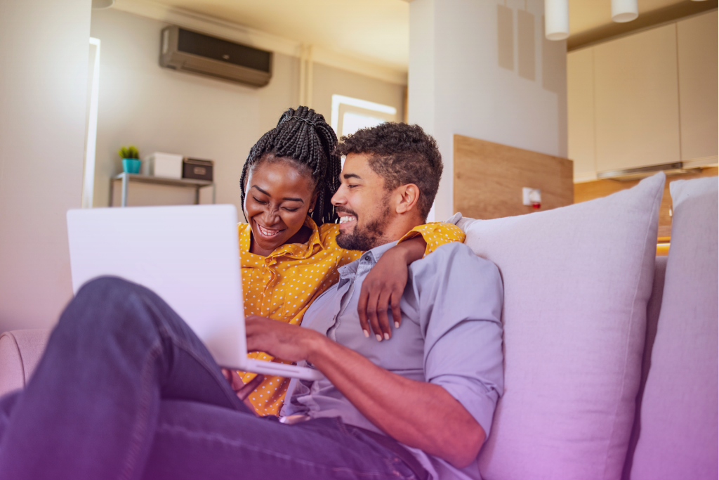 A married couple reviewing financial documents together, representing postnuptial financial planning.