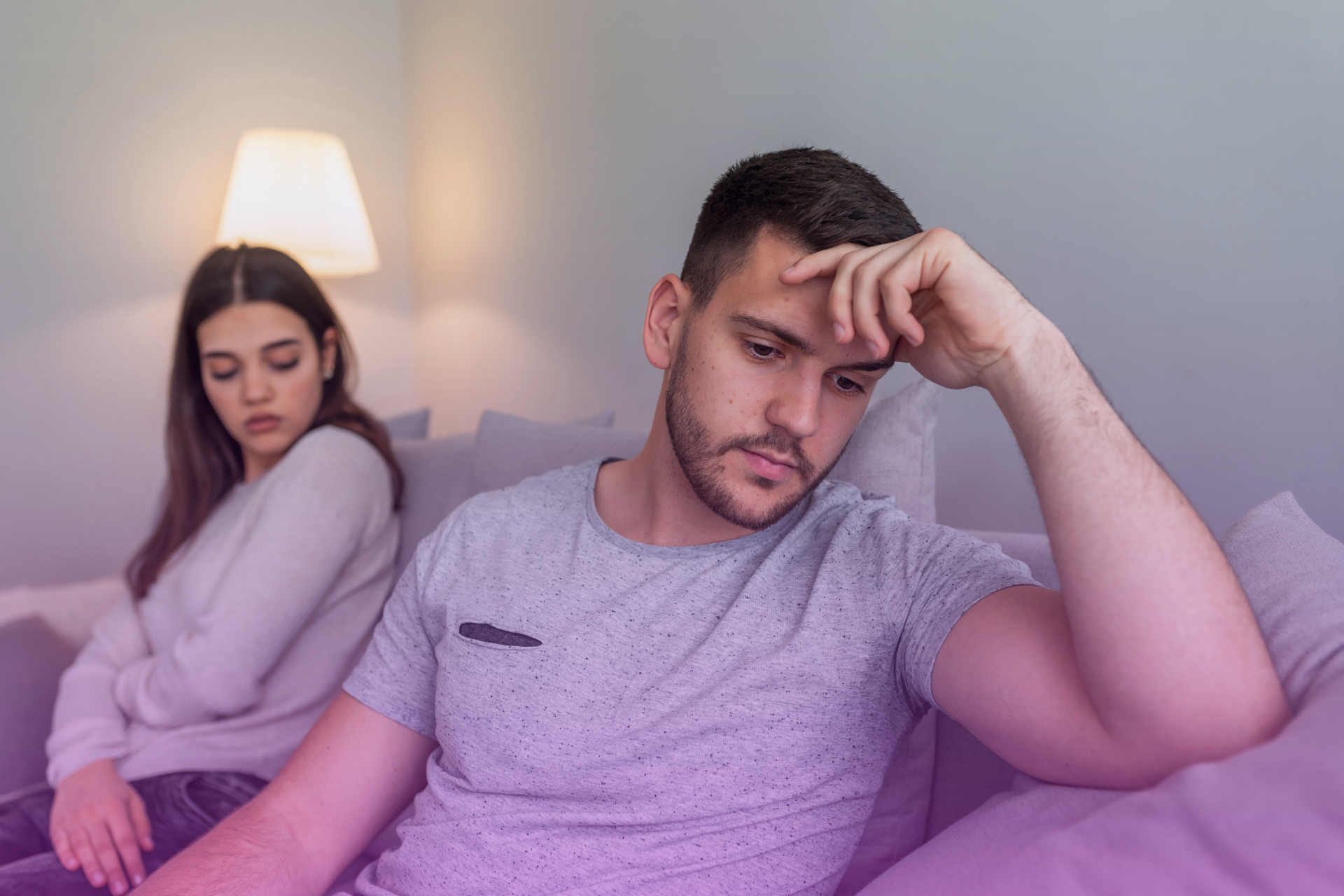 A couple walking outdoors, looking in opposite directions, symbolizing a lack of shared goals and a disconnect.