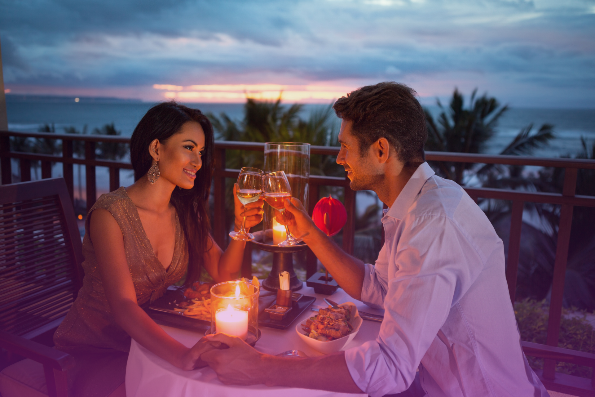 couple-looking-into-each-faces-sunset A loving couple gazing into each other's eyes during a romantic sunset.