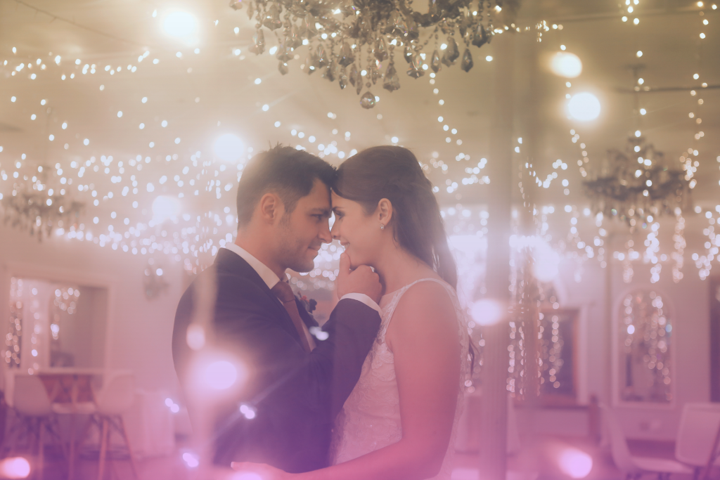 A deeply in love couple embracing on their wedding day, radiating happiness and excitement for their future together.