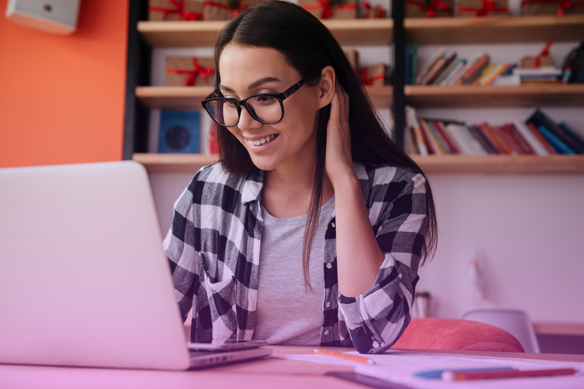 A person sitting at a laptop computer in California, working on an online will document.