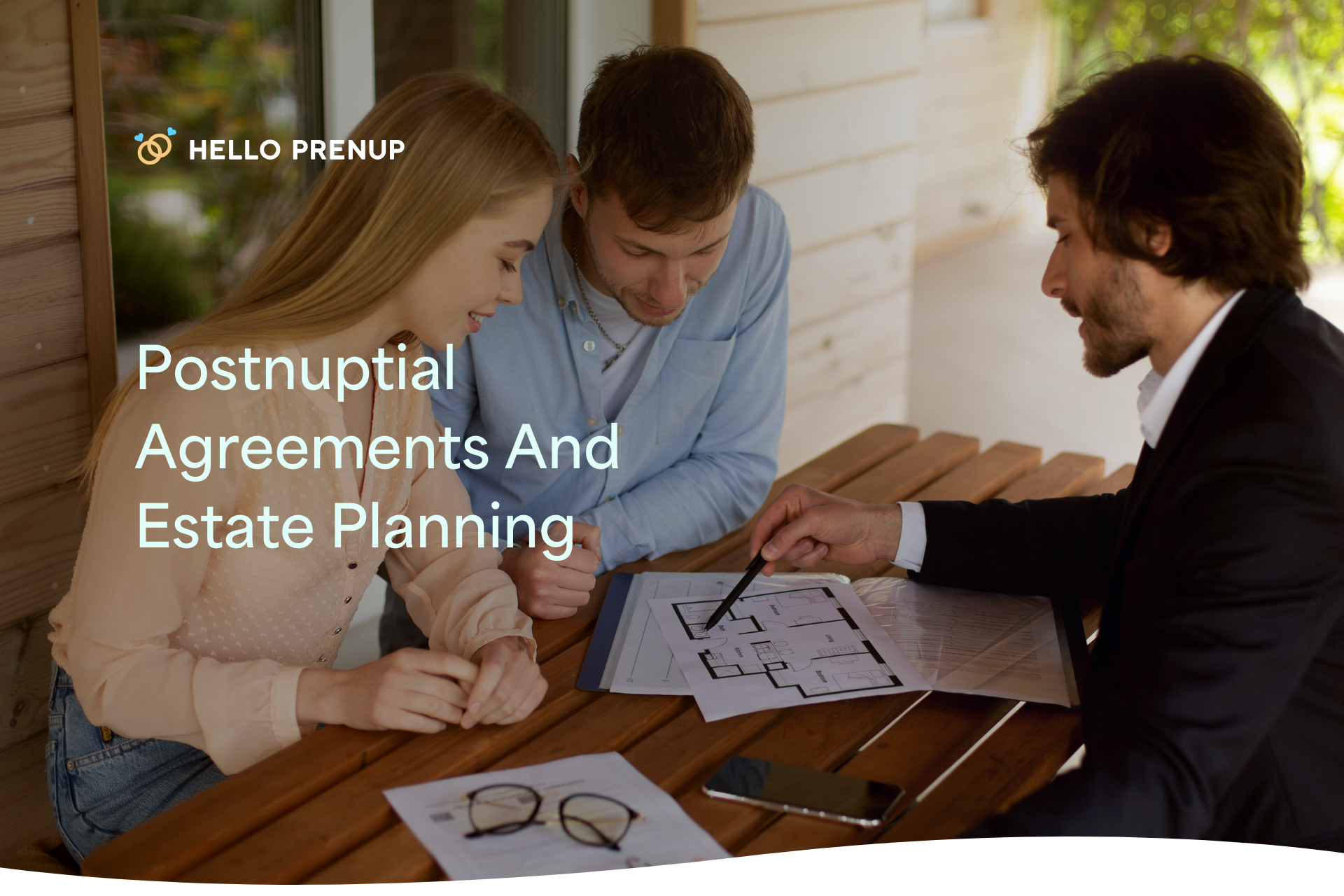 A happy couple sitting at a table with a lawyer, discussing a postnuptial agreement and estate planning documents.