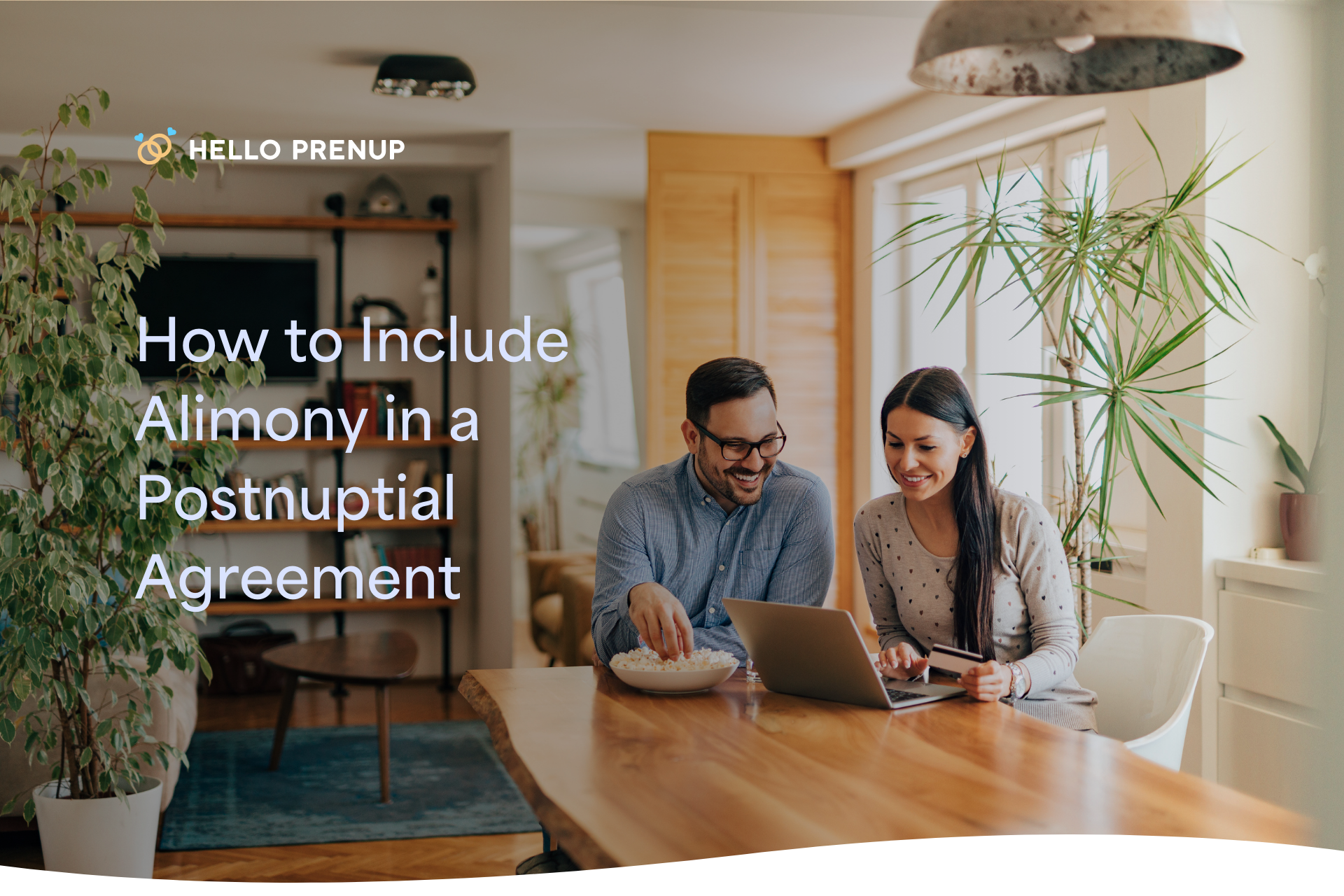 couple-discussing-alimony-postnup A happy couple sitting at a table, reviewing a document and talking together, possibly discussing alimony clauses in their postnup.