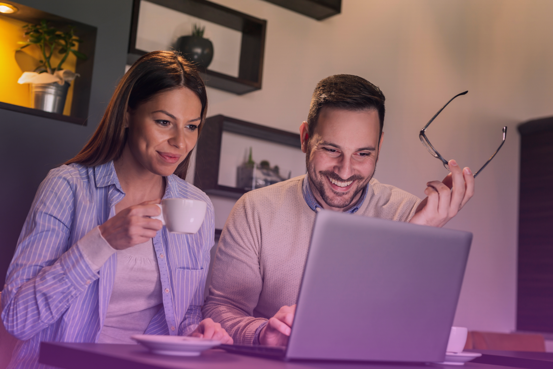 A couple sits at a computer screen, reviewing a legal document related to their will