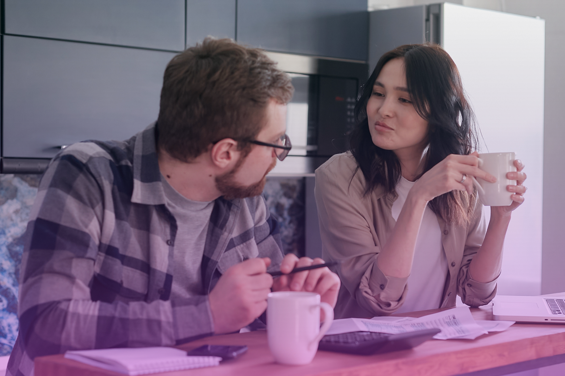 A couple talking to a lawyer about a prenuptial agreement.