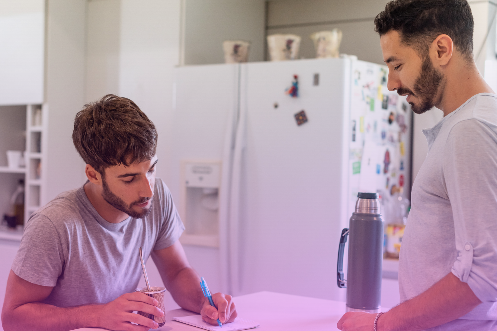 A couple signing a postnuptial agreement 