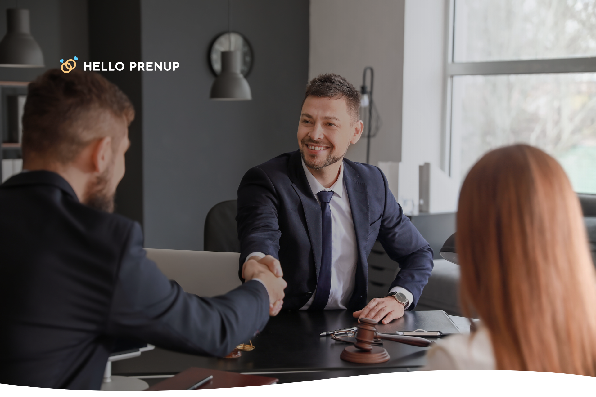 A couple in Ontario sitting with a lawyer, discussing the enforcement of their prenuptial agreement.