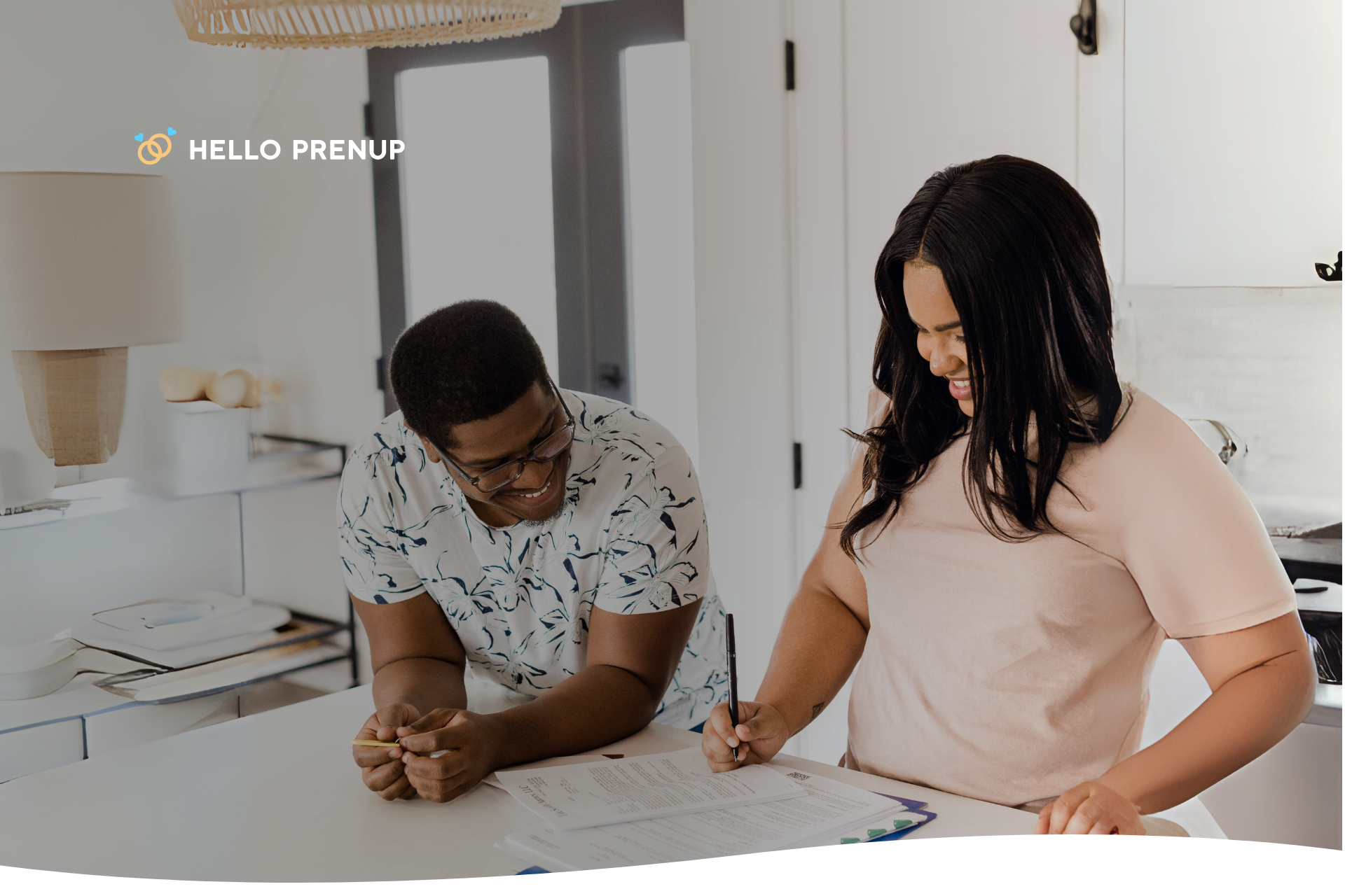 couple_signing_prenup_nm Couple signing a prenuptial agreement in a New Mexico law office