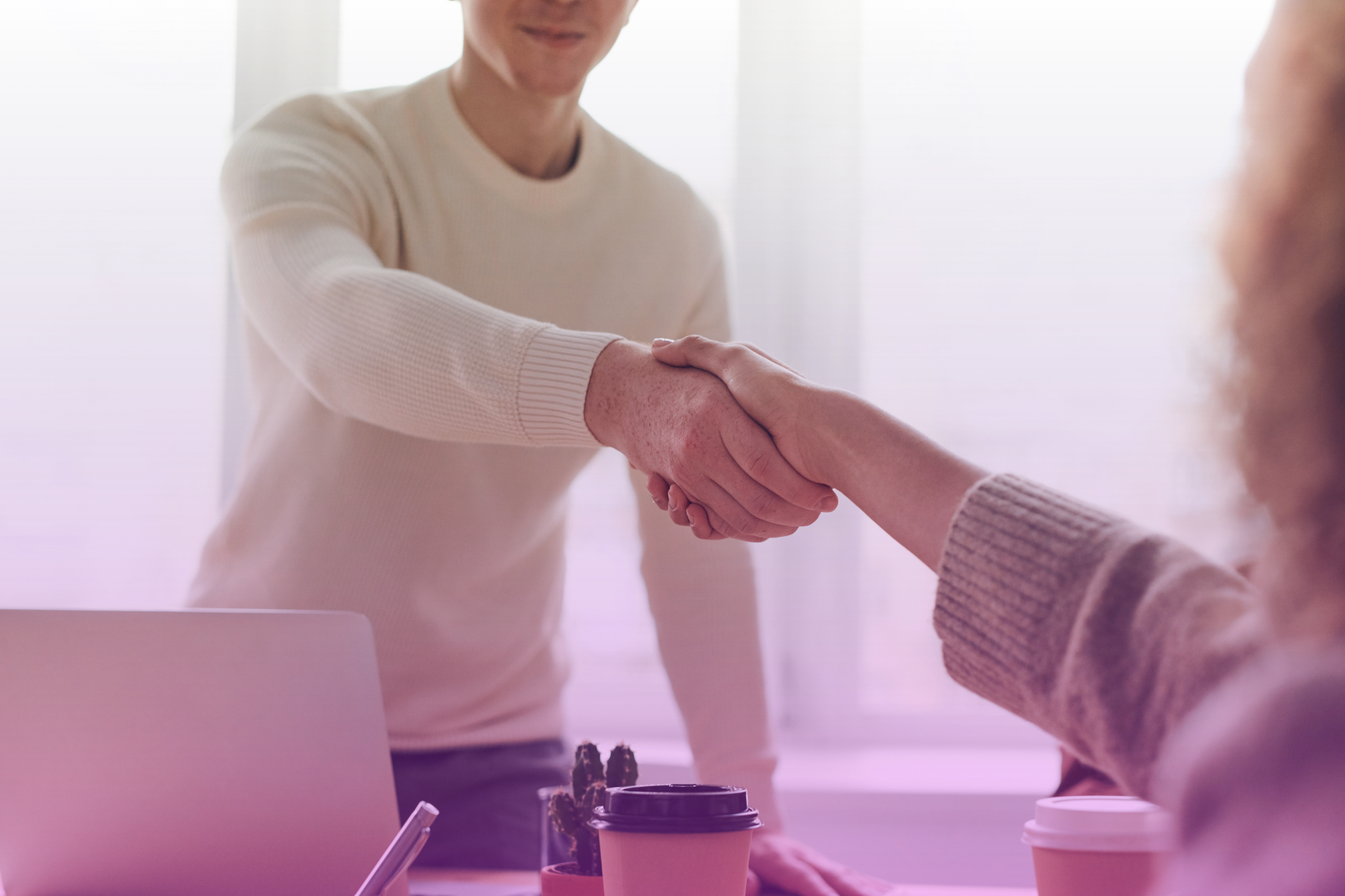 Engaged Kansas couple discussing prenuptial agreement with a lawyer