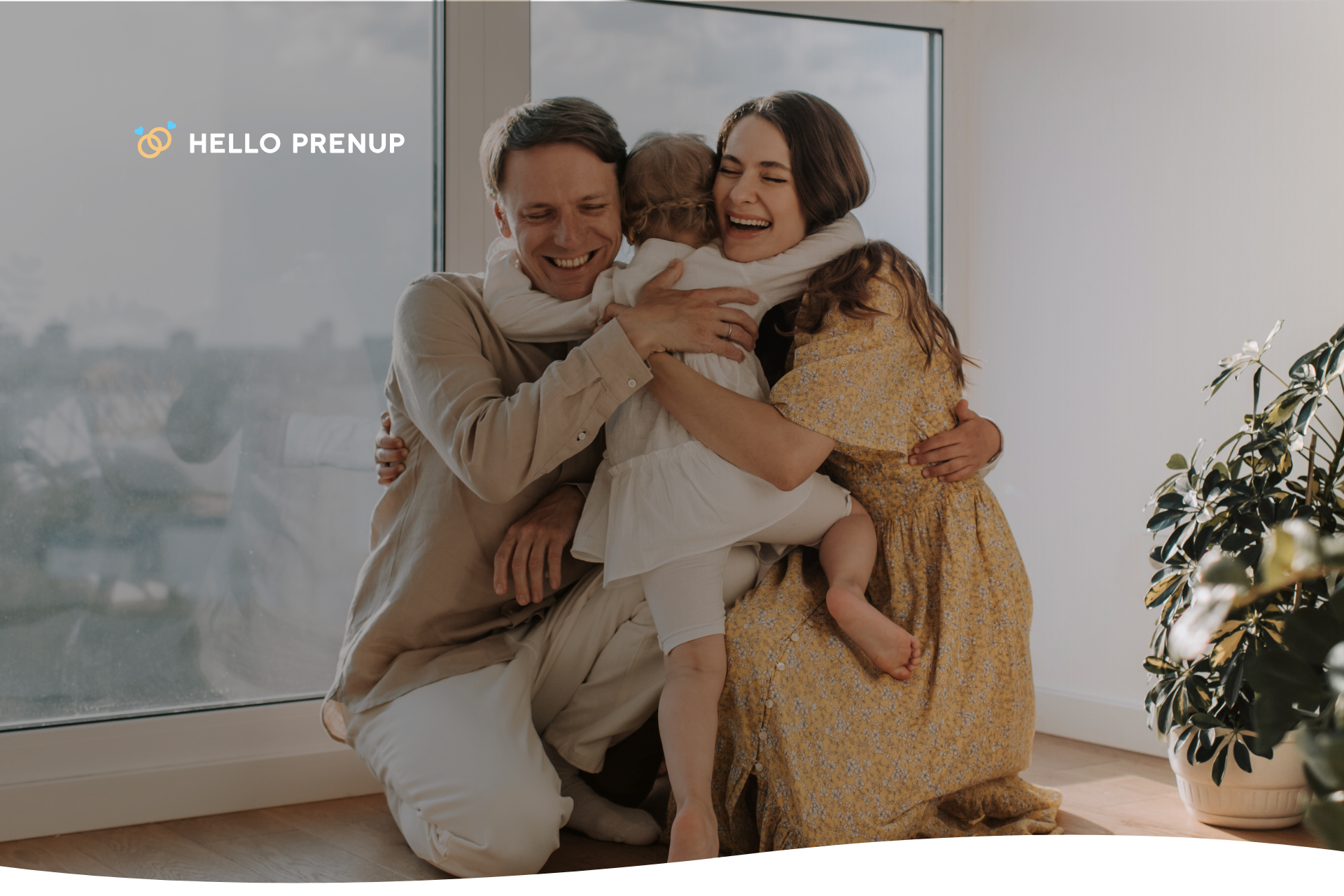 A couple laughing and hugging with their daughter, symbolizing the happiness that comes from a good marriage and a loving family.
