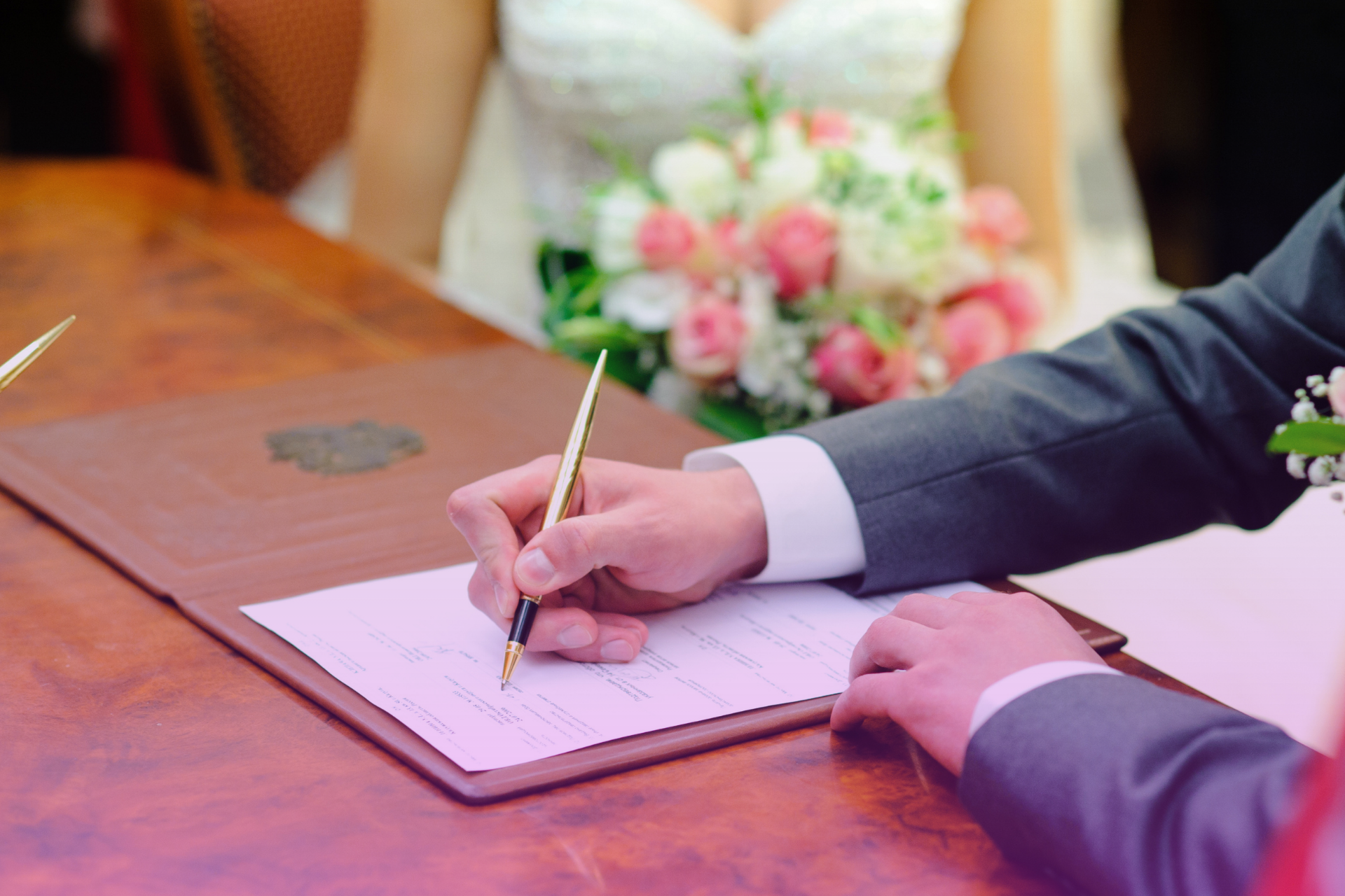 Bride and groom holding a prenuptial agreement in North Carolina
