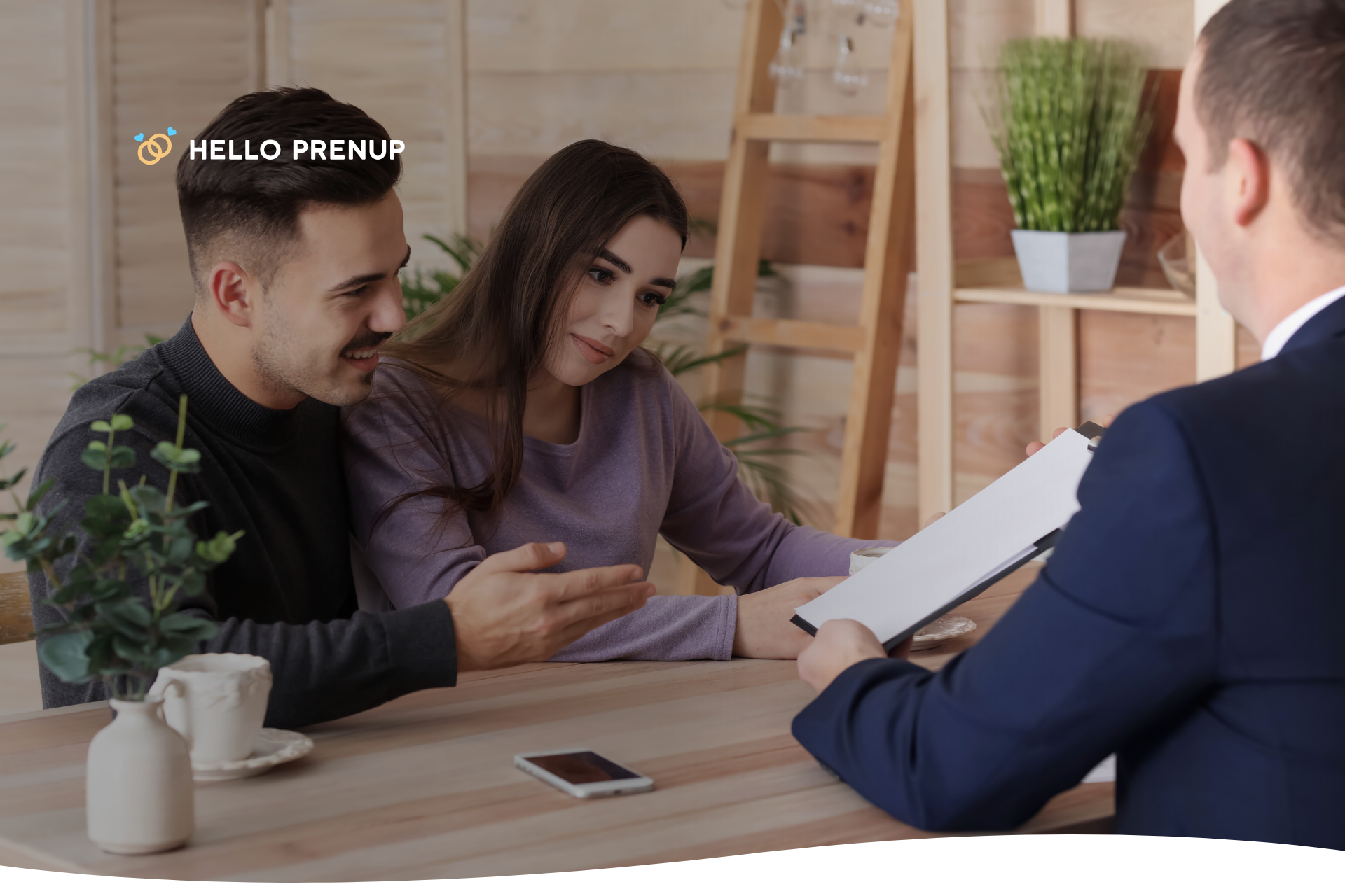 Couple meeting with an attorney to discuss inheritance in a postnuptial agreement