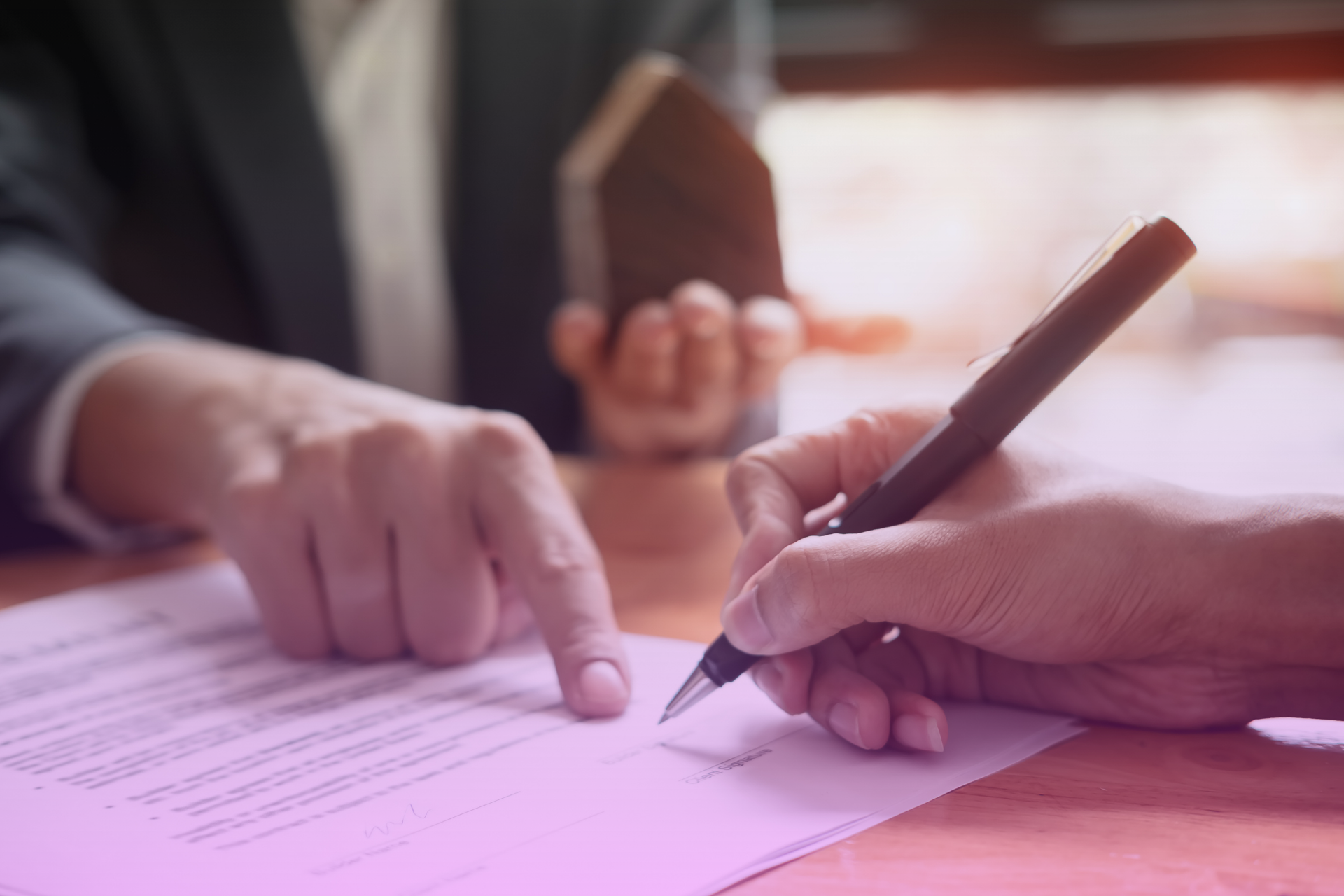 Attorney guiding a client through signing a codicil to amend a will
