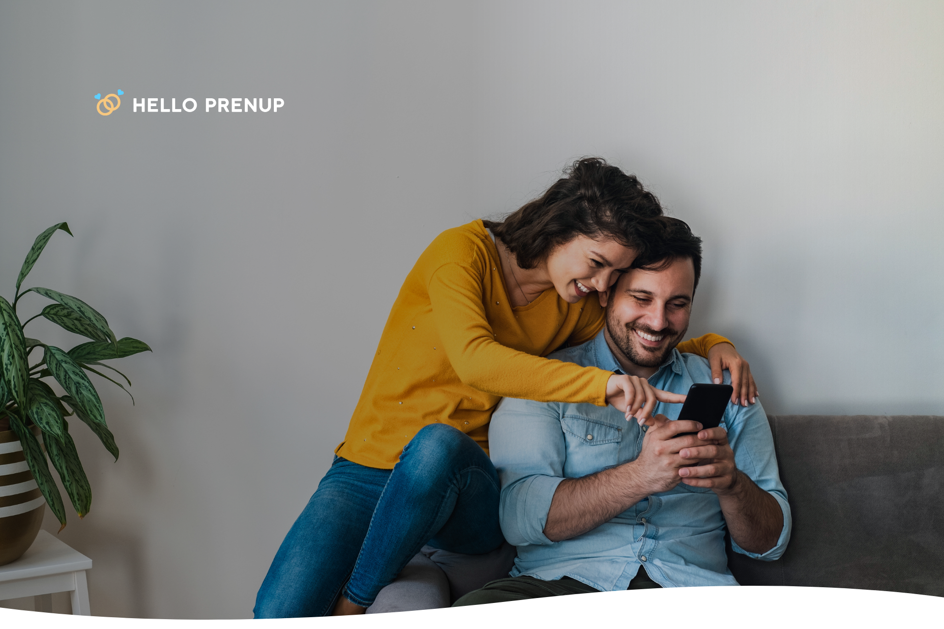 couple_checking_documents_smiling Smiling couple signing legal agreements at home