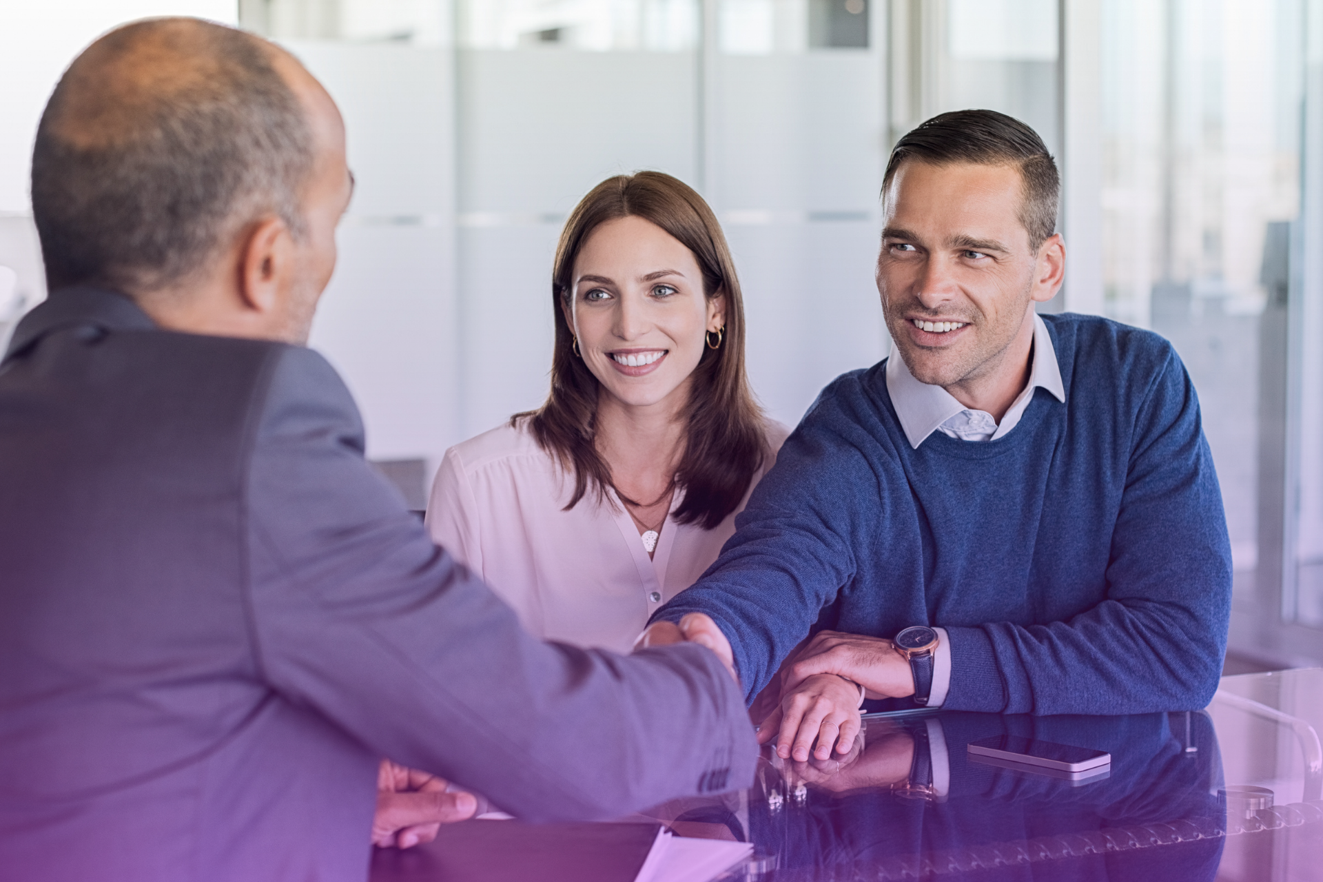 Couple sitting with estate attorney discussing guardianship provisions